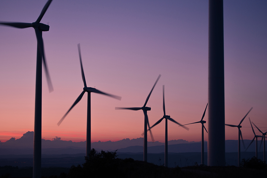 Wind turbines with red sky in the background