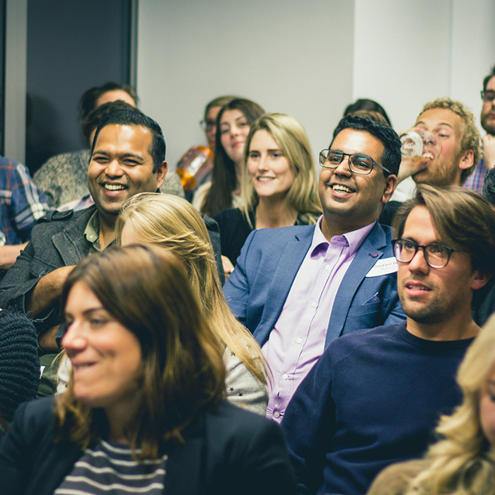 LandscapeA group of people at a conference 